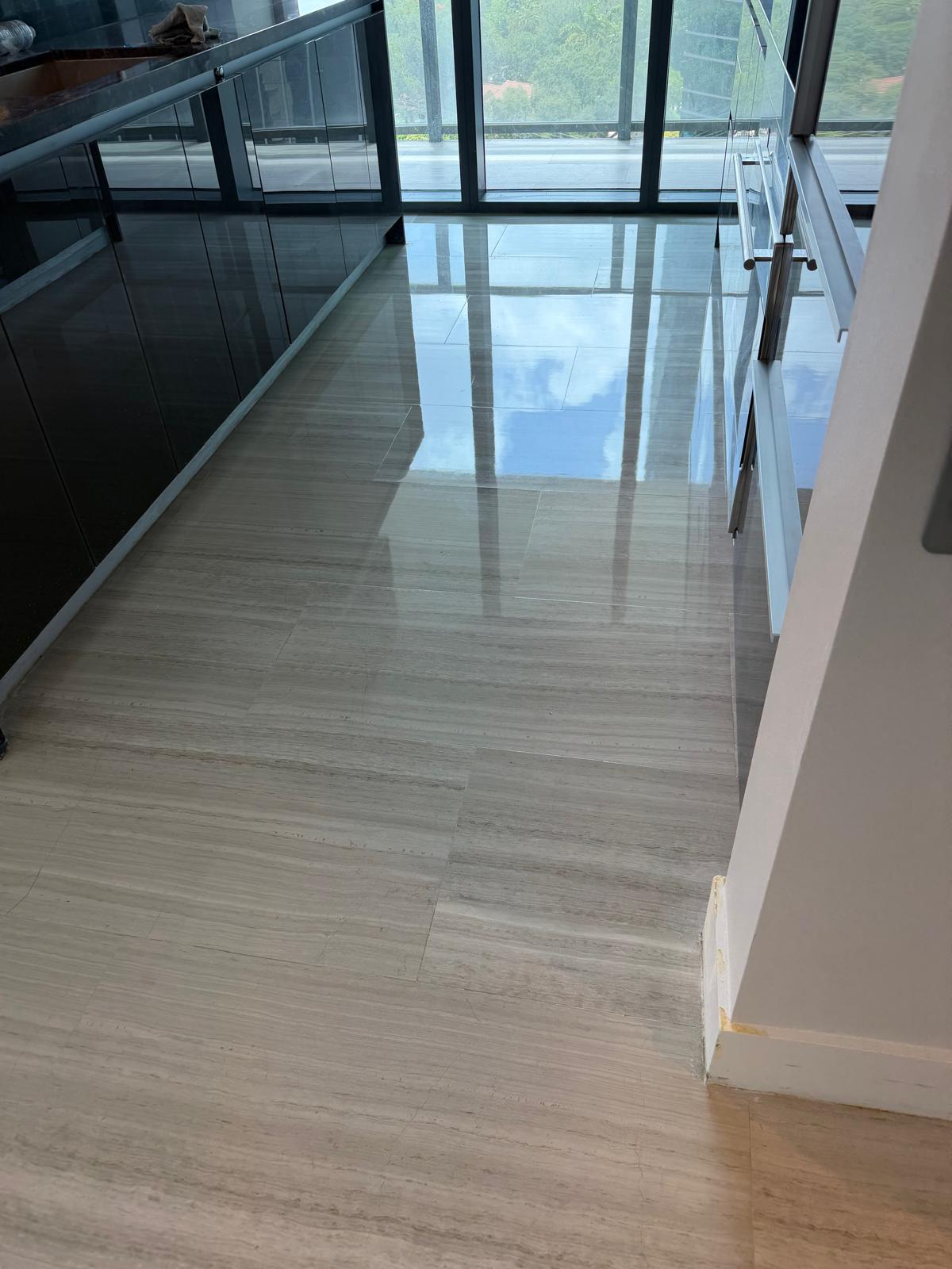 Marble restoration specialists polishing a natural stone floor in a Florida home